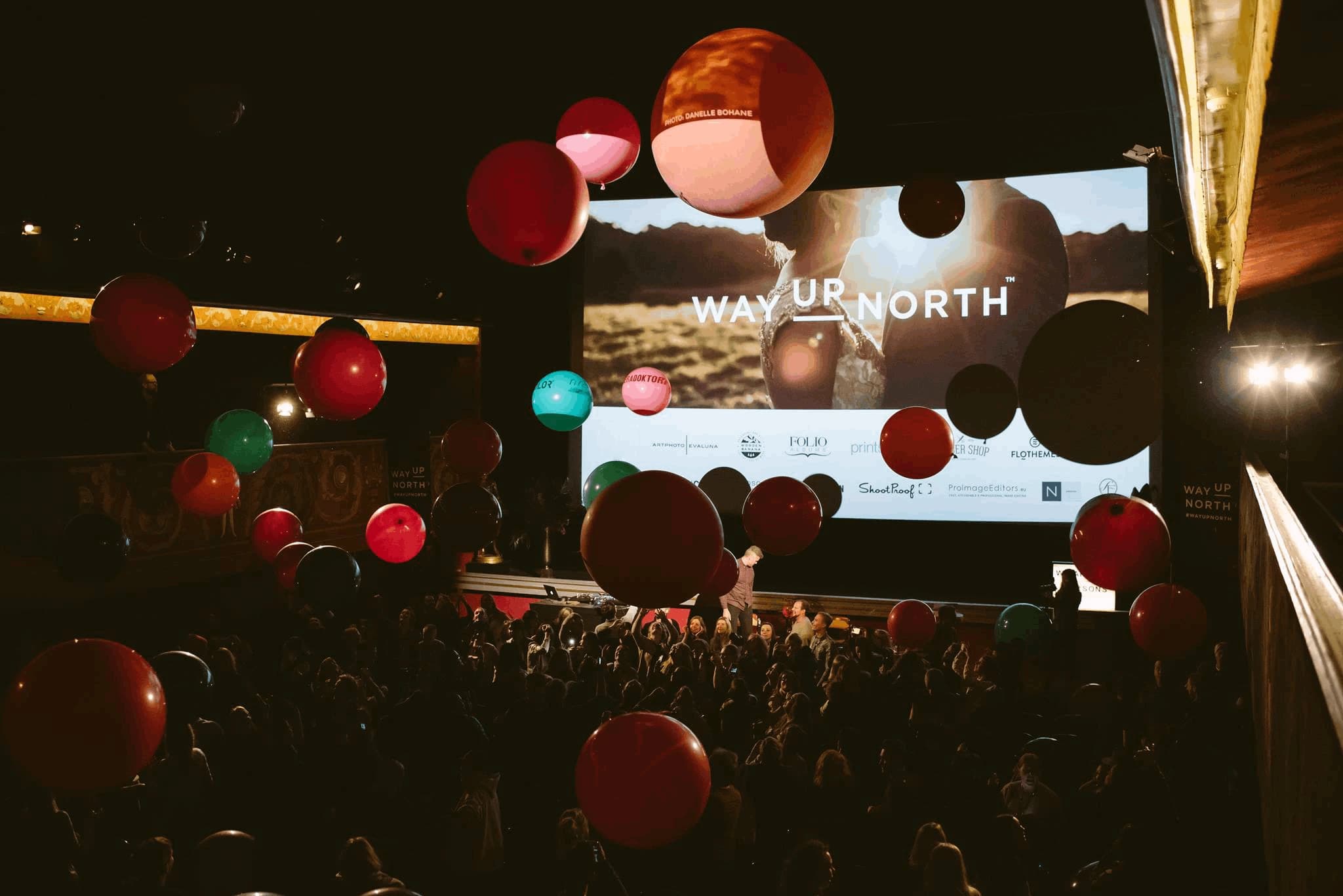 Balloons above the audience at a Way Up North gathering