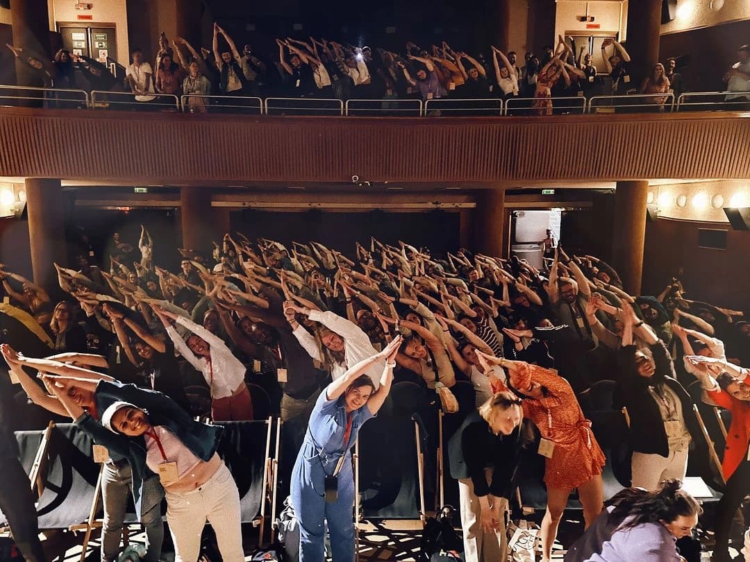 The Way Up North audience stretching together in a theatre in Prague