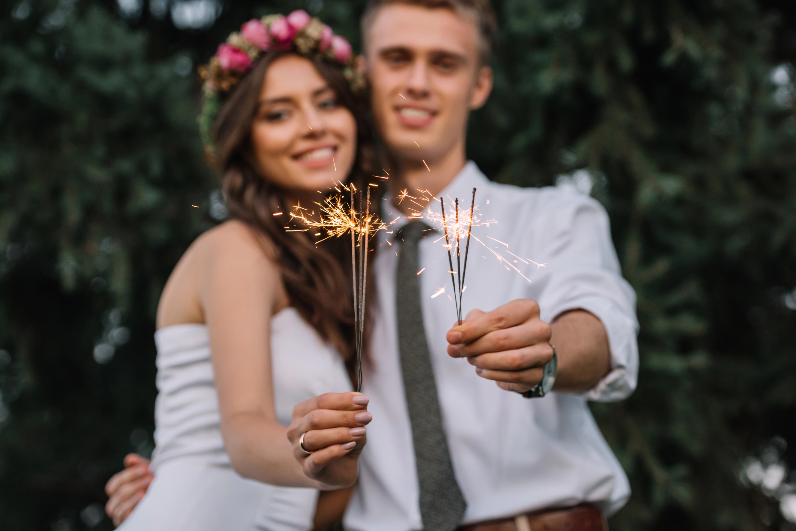 A couple leaving through a sparkler send-off at the end of a wedding